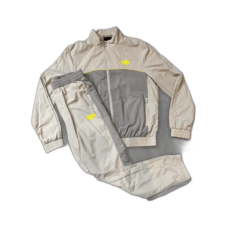 SYNAWORLD “SYNA LOGO” Tuta Shell Crema Grigio Giallo SYNAWORLD “SYNA LOGO” Tuta Shell Crema Grigio Giallo